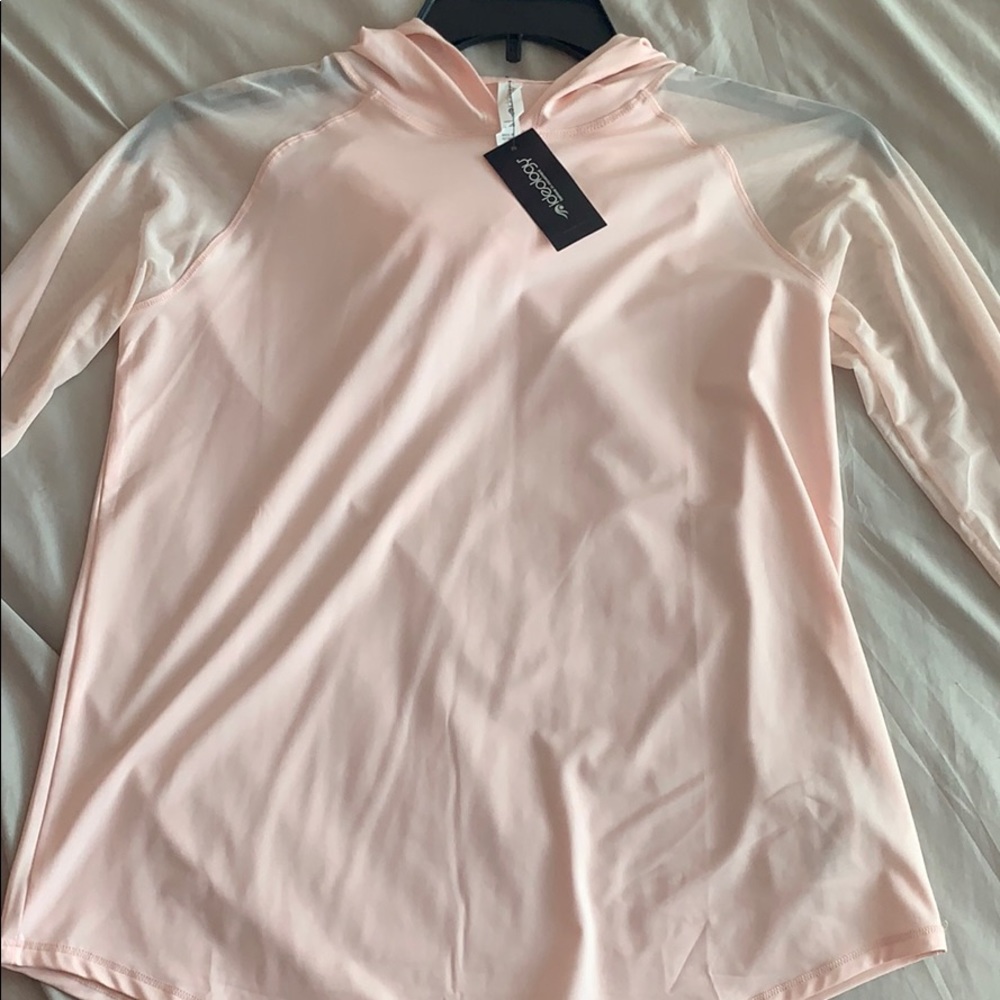 a light pink sheer workout cover up